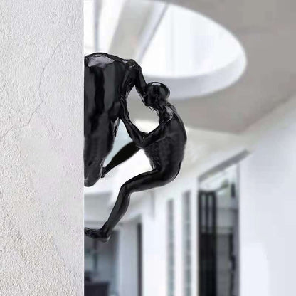 Kletterwand hängende Statuen