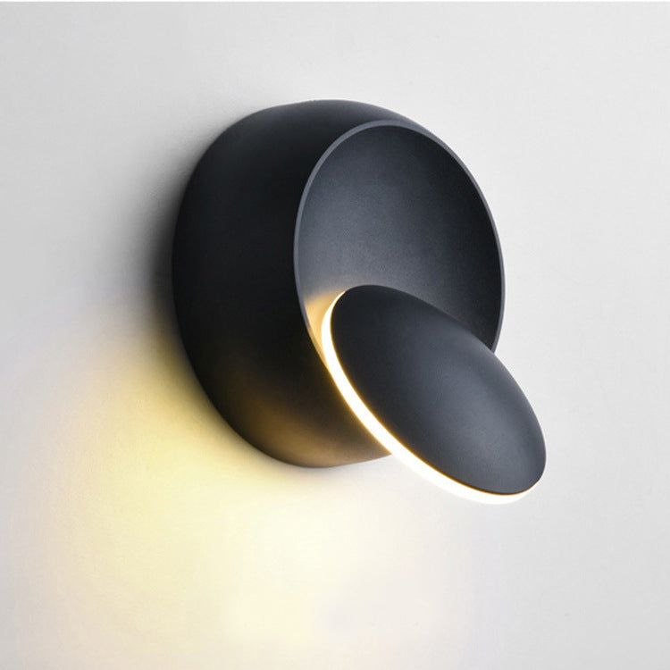 Zeitgenössische nordische Eisenrunde Eclipse rotierbare LED-Wandleuchte für Nachttisch