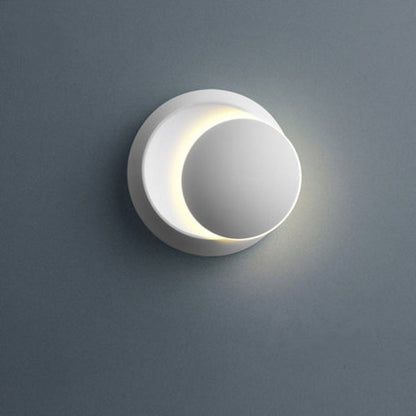 Zeitgenössische nordische Eisenrunde Eclipse rotierbare LED-Wandleuchte für Nachttisch