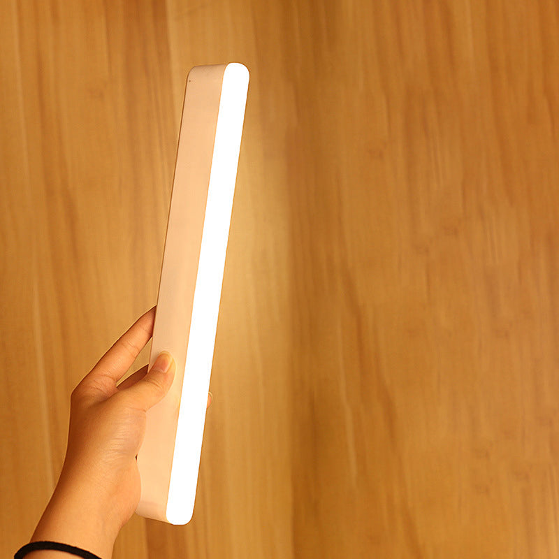 Moderne minimalistische wiederaufladbare magnetische Saugnapf Kunststoffstreifen rechteckige LED-Wandlampe Nachtlicht zum Lernen