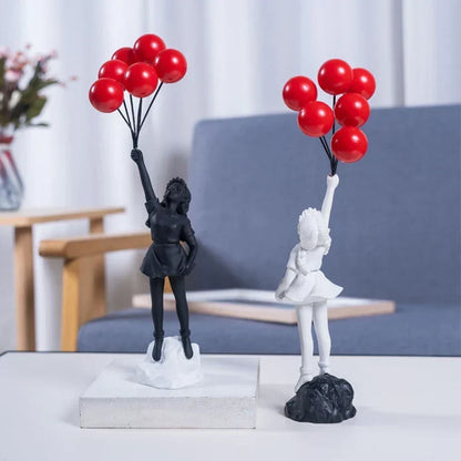 Skulptur eines Mädchens mit Ballon im Banksy-Stil zur Tischdekoration und kreativen Wohnzimmerschmuck